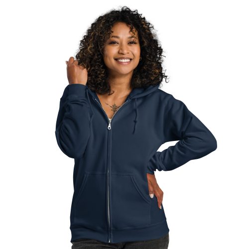 VCC: Sentence with Product Name: Smiling woman with curly hair wearing a navy blue Unisex heavy blend zip hoodie, standing with one hand on her hip.